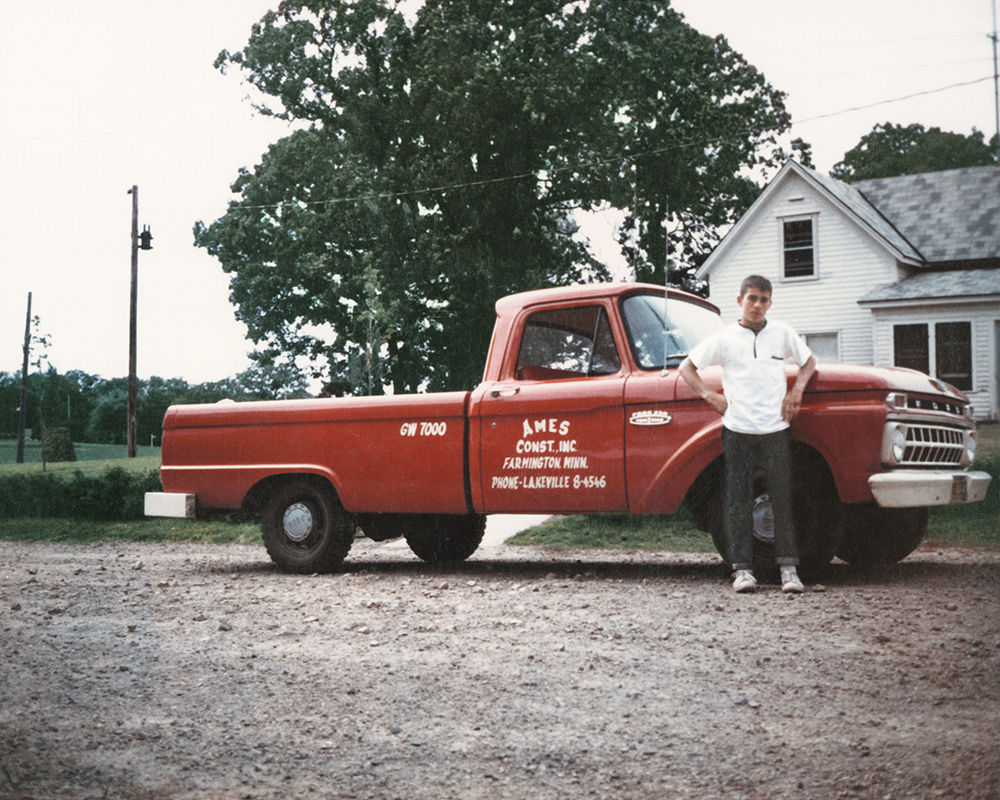 Young Larry Ames, Standing Beside Ames Truck